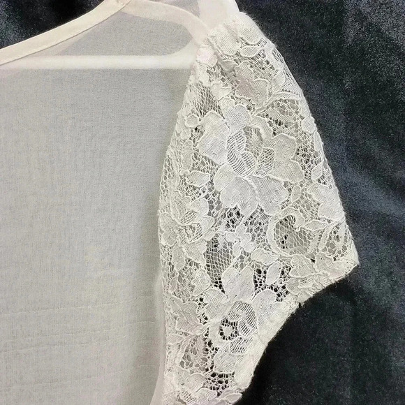 Cream colored lush cardigan with lacework sleeves and button up back like new - Picture 2 of 8